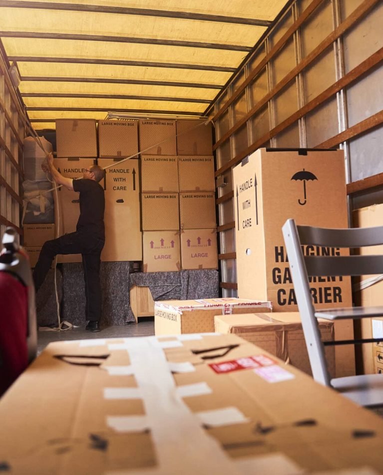 Removal company helping a family move out of their old home